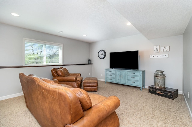 living room with light colored carpet, baseboards, recessed lighting, and a textured ceiling