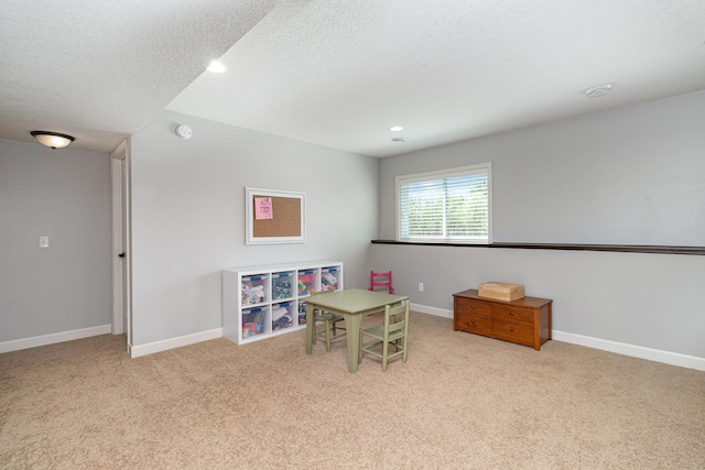 playroom with carpet floors, a textured ceiling, recessed lighting, and baseboards