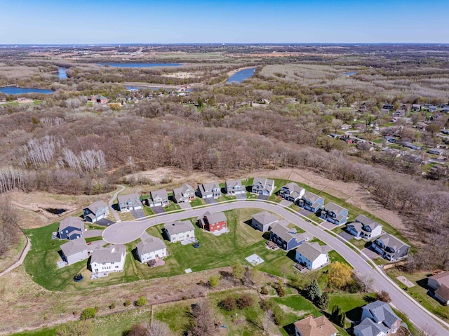 bird's eye view featuring a water view and a residential view