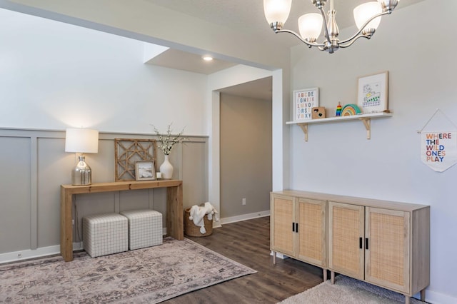 interior space with wood finished floors and a notable chandelier