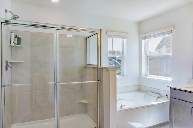 full bath featuring a garden tub, a stall shower, and vanity