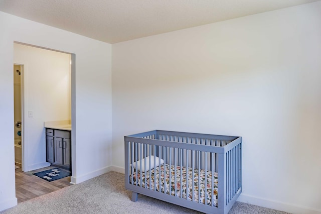 carpeted bedroom with baseboards