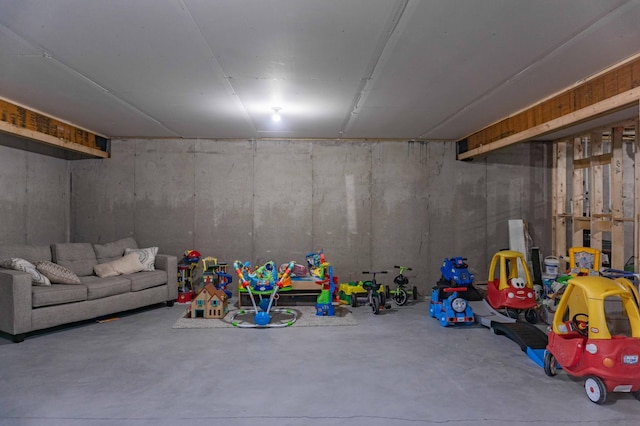rec room featuring concrete flooring