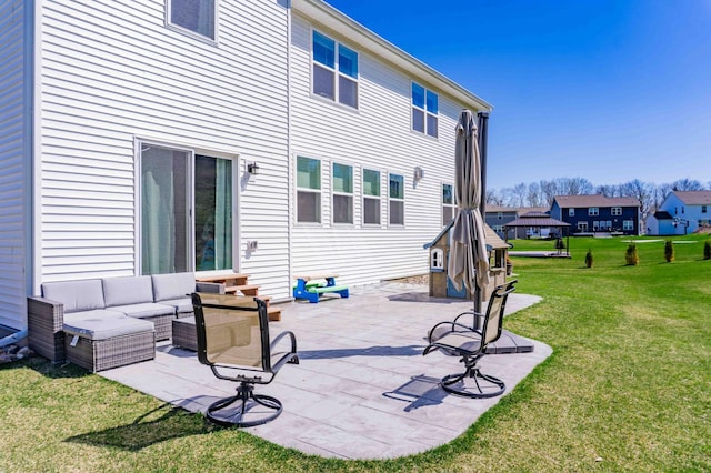 back of house with a yard, a patio, and an outdoor living space