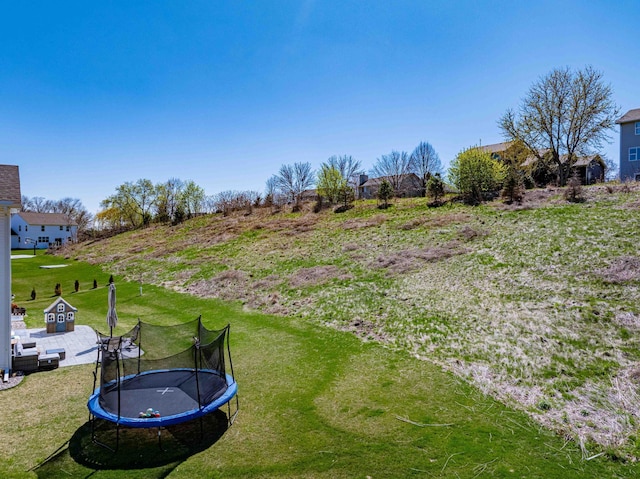 view of yard with a trampoline