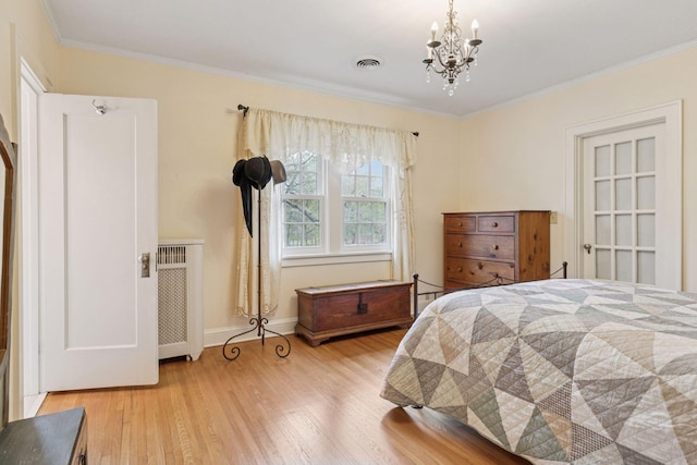 26 Mississippi River Blvd N, Saint Paul, MN 55104 - bedroom with radiator heating unit, wood finished floors, ornamental molding, a chandelier, and baseboards