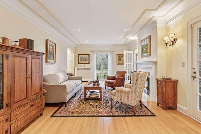 26 Mississippi River Blvd N, Saint Paul, MN 55104 - living area with ornamental molding, light wood finished floors, a fireplace, arched walkways, and recessed lighting