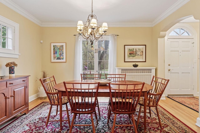 26 Mississippi River Blvd N, Saint Paul, MN 55104 - dining room with light wood-style floors, ornamental molding, a chandelier, and baseboards