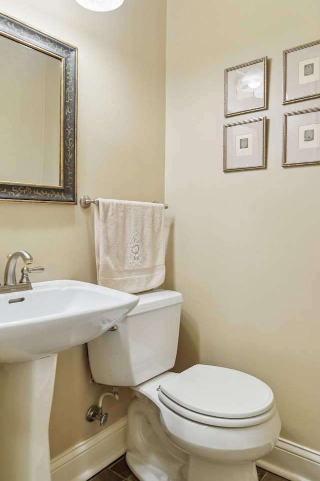 26 Mississippi River Blvd N, Saint Paul, MN 55104 - half bath featuring baseboards, toilet, and tile patterned floors