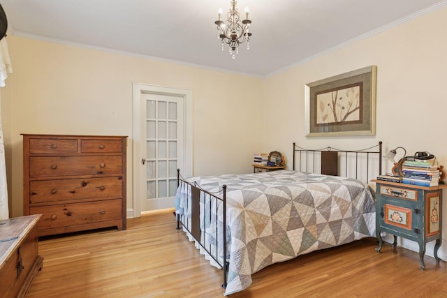 26 Mississippi River Blvd N, Saint Paul, MN 55104 - bedroom with light wood-style floors, ornamental molding, and a chandelier