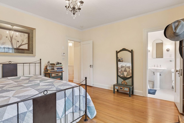 26 Mississippi River Blvd N, Saint Paul, MN 55104 - bedroom with a chandelier, light wood-type flooring, crown molding, and baseboards