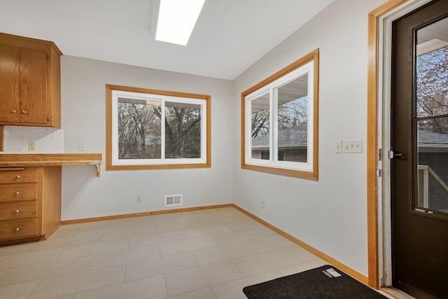 1034 Birch St, Lino Lakes, MN 55014 - unfurnished dining area featuring a healthy amount of sunlight, baseboards, and visible vents