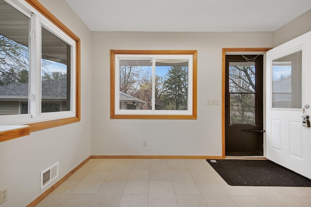1034 Birch St, Lino Lakes, MN 55014 - entrance foyer featuring baseboards, visible vents, and a wealth of natural light