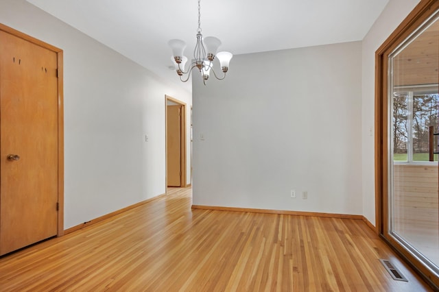 1034 Birch St, Lino Lakes, MN 55014 - unfurnished room featuring baseboards, a chandelier, visible vents, and light wood-type flooring