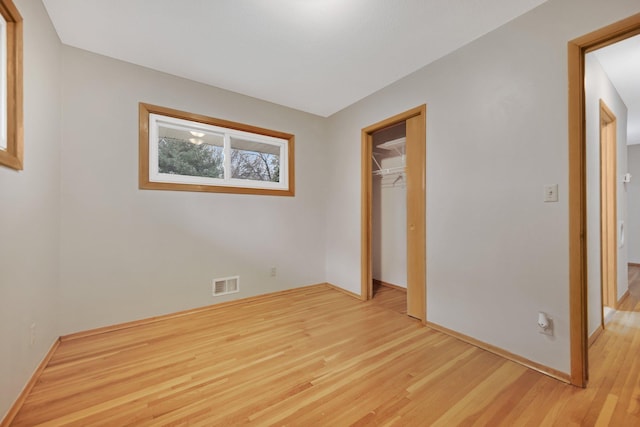 1034 Birch St, Lino Lakes, MN 55014 - unfurnished bedroom with baseboards, visible vents, light wood-style flooring, and a closet