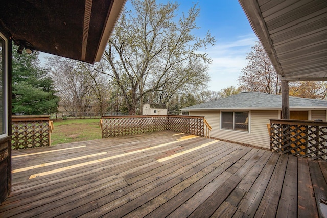 1034 Birch St, Lino Lakes, MN 55014 - deck featuring a lawn, an outbuilding, a shed, and a fenced backyard