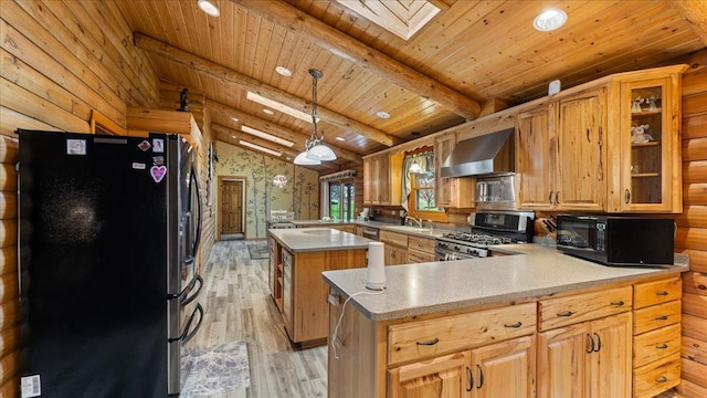 18100 Stockhousen Rd NW, Evansville, MN 56326 - kitchen with appliances with stainless steel finishes, vaulted ceiling with skylight, wall chimney exhaust hood, a peninsula, and wood ceiling