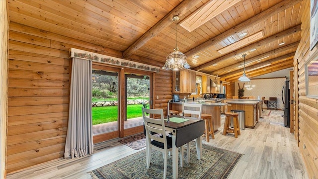 18100 Stockhousen Rd NW, Evansville, MN 56326 - dining space with vaulted ceiling with skylight, wood ceiling, light wood-type flooring, and a chandelier