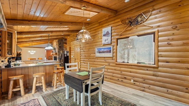 18100 Stockhousen Rd NW, Evansville, MN 56326 - dining space with log walls, a skylight, light wood-style flooring, beamed ceiling, and wood ceiling