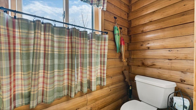 18100 Stockhousen Rd NW, Evansville, MN 56326 - bathroom featuring wooden walls and toilet