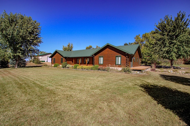 18100 Stockhousen Rd NW, Evansville, MN 56326 - exterior space with log exterior, metal roof, and a front lawn