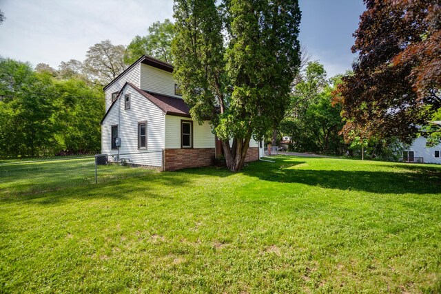 5371 Hugo Rd, White Bear Twp, MN 55110 - view of property exterior featuring central AC