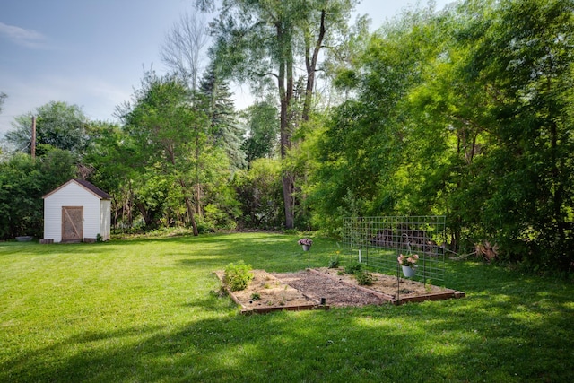 5371 Hugo Rd, White Bear Twp, MN 55110 - view of grassy yard featuring a vegetable garden