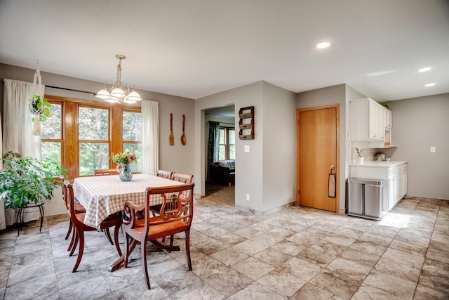 5371 Hugo Rd, White Bear Twp, MN 55110 - dining area featuring a chandelier, baseboards, and recessed lighting