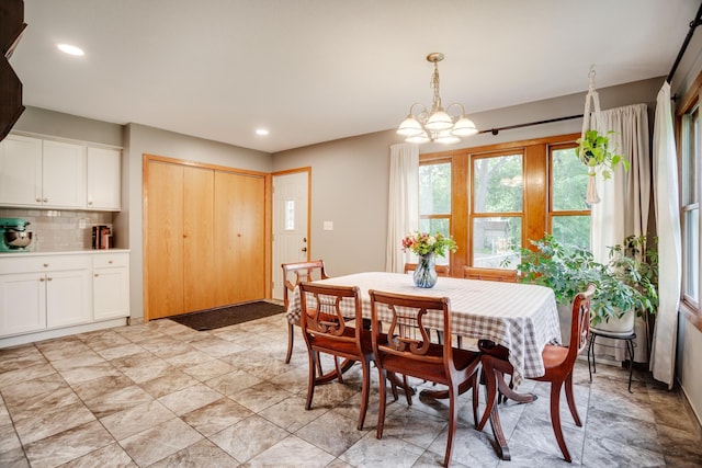 5371 Hugo Rd, White Bear Twp, MN 55110 - dining area featuring a chandelier and recessed lighting