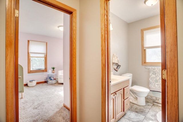 5371 Hugo Rd, White Bear Twp, MN 55110 - bathroom with healthy amount of natural light, vanity, and toilet
