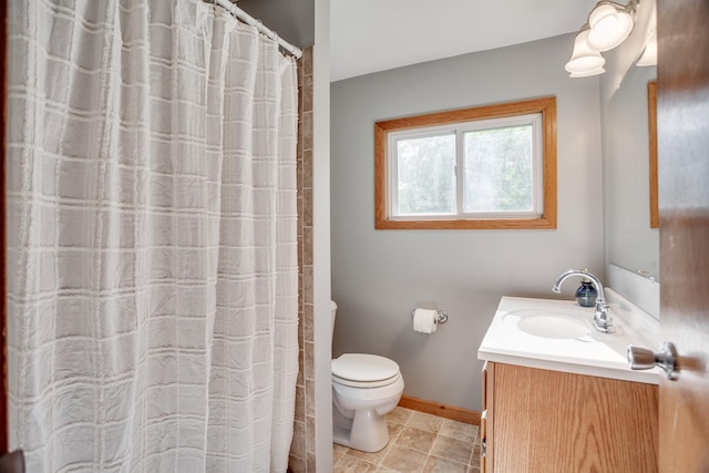 5371 Hugo Rd, White Bear Twp, MN 55110 - bathroom with vanity, toilet, and baseboards