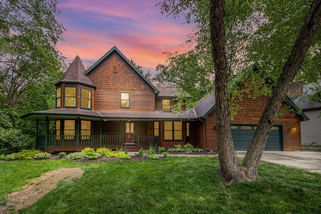 8762 Highwood Way, Apple Valley, MN 55124 - view of front facade featuring a porch, concrete driveway, and a lawn