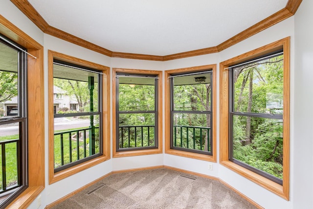 8762 Highwood Way, Apple Valley, MN 55124 - unfurnished sunroom featuring baseboards, crown molding, and carpet flooring