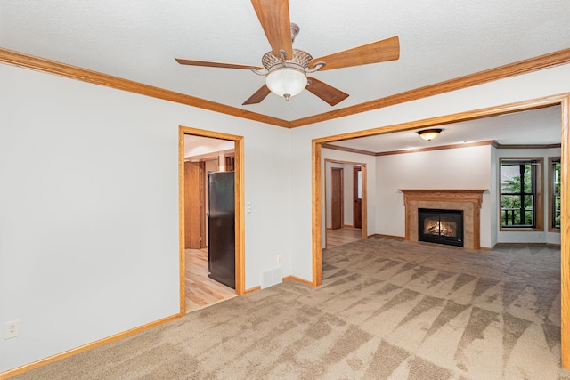 8762 Highwood Way, Apple Valley, MN 55124 - unfurnished living room featuring carpet floors, baseboards, a fireplace with flush hearth, a ceiling fan, and ornamental molding