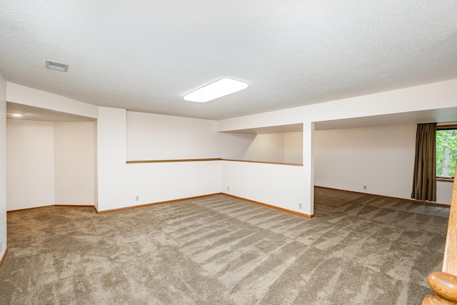 8762 Highwood Way, Apple Valley, MN 55124 - basement featuring carpet, baseboards, and a textured ceiling