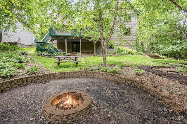 8762 Highwood Way, Apple Valley, MN 55124 - rear view of property with stairs, an outdoor fire pit, a wooden deck, and a yard