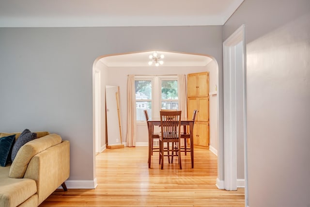 4830 29th Ave S, Minneapolis, MN 55417 - dining space with arched walkways, light wood-type flooring, and a chandelier