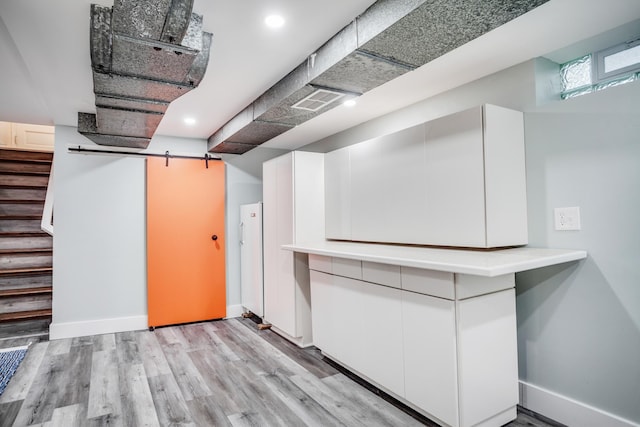 4830 29th Ave S, Minneapolis, MN 55417 - basement featuring light wood-type flooring, stairway, and recessed lighting