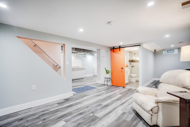 4830 29th Ave S, Minneapolis, MN 55417 - living room featuring wood finished floors, recessed lighting, and a barn door