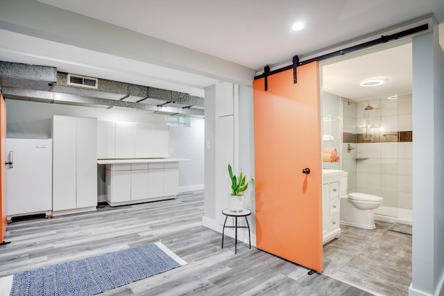 4830 29th Ave S, Minneapolis, MN 55417 - interior space featuring light wood-type flooring, a barn door, and recessed lighting
