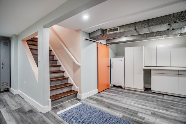 4830 29th Ave S, Minneapolis, MN 55417 - finished basement with stairway, light wood-style floors, and recessed lighting