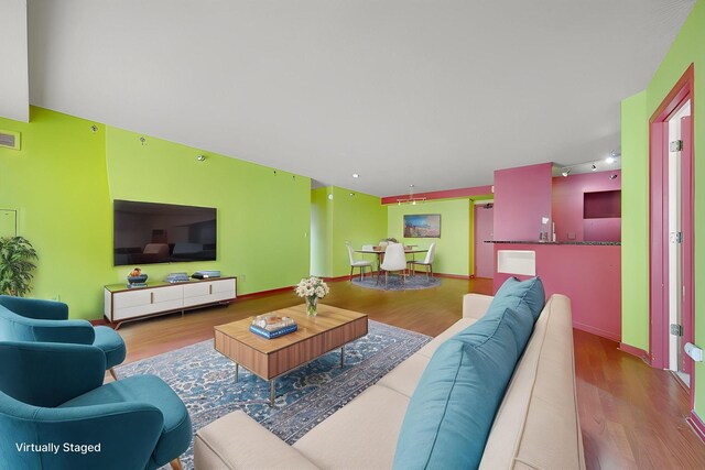 401 1st St Unit 401, Minneapolis, MN 55401 - living room featuring wood finished floors and baseboards
