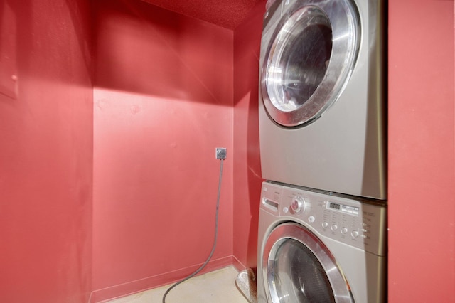 401 1st St Unit 401, Minneapolis, MN 55401 - clothes washing area with stacked washer and clothes dryer and baseboards