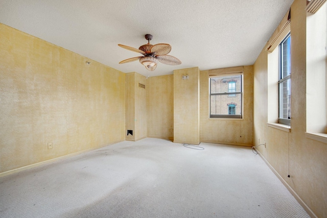 401 1st St Unit 401, Minneapolis, MN 55401 - carpeted spare room with a ceiling fan, baseboards, and a textured ceiling