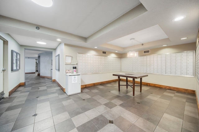401 1st St Unit 401, Minneapolis, MN 55401 - playroom with mail area, a tray ceiling, baseboards, and recessed lighting