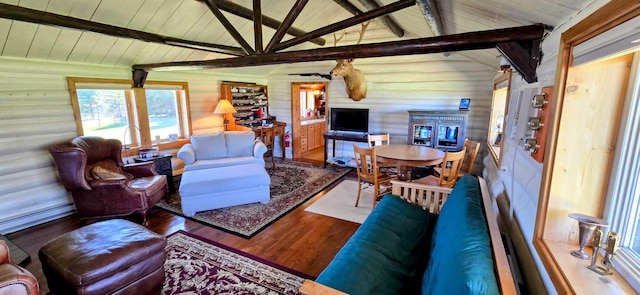 living area featuring wood ceiling, wood finished floors, and a baseboard radiator
