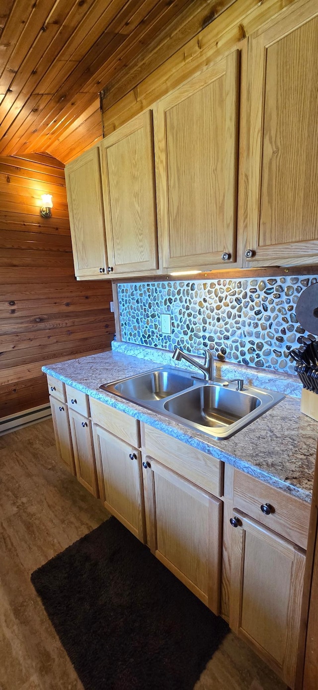 kitchen featuring a sink, light brown cabinetry, wood ceiling, and light countertops