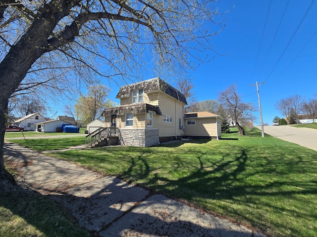 view of property exterior featuring a lawn