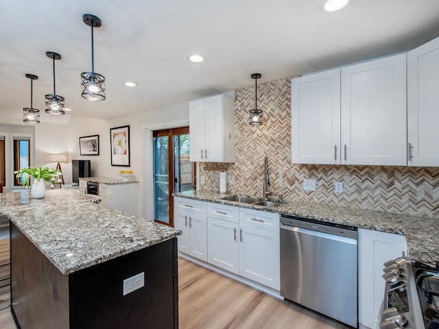 2415 Edgerton St, Little Canada, MN 55117 - kitchen with appliances with stainless steel finishes, a sink, a center island, backsplash, and recessed lighting