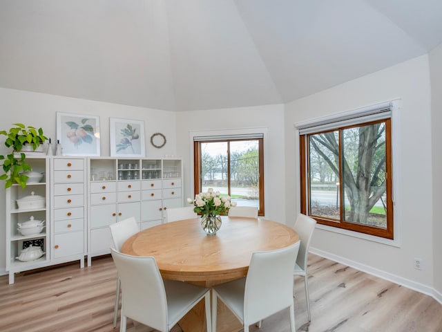 2415 Edgerton St, Little Canada, MN 55117 - dining space with light wood finished floors, healthy amount of natural light, and high vaulted ceiling